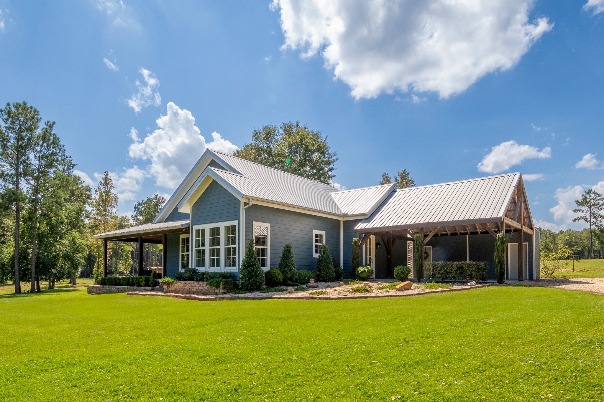 Modern farmhouse with metal roof and covered porch